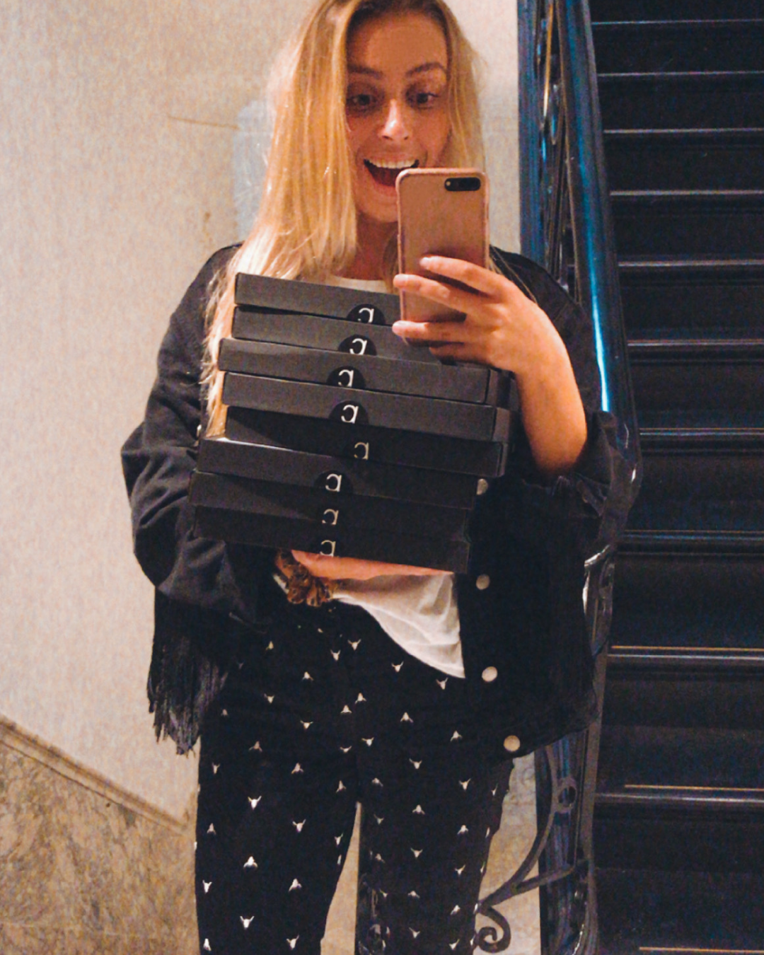 elise with pavo packages in the mirror